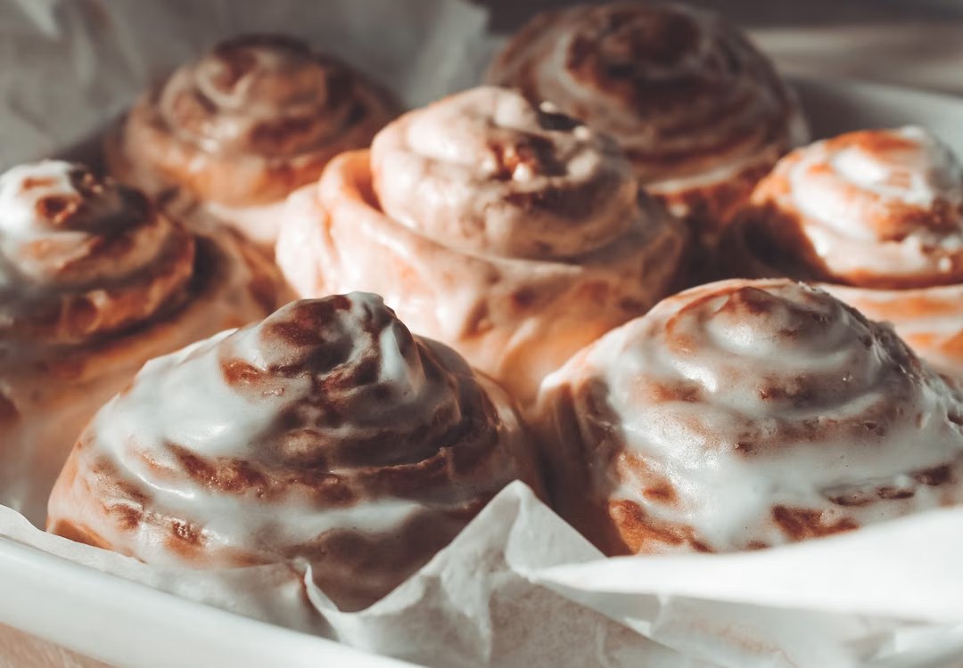 Fresh cinnamon rolls covered in icing