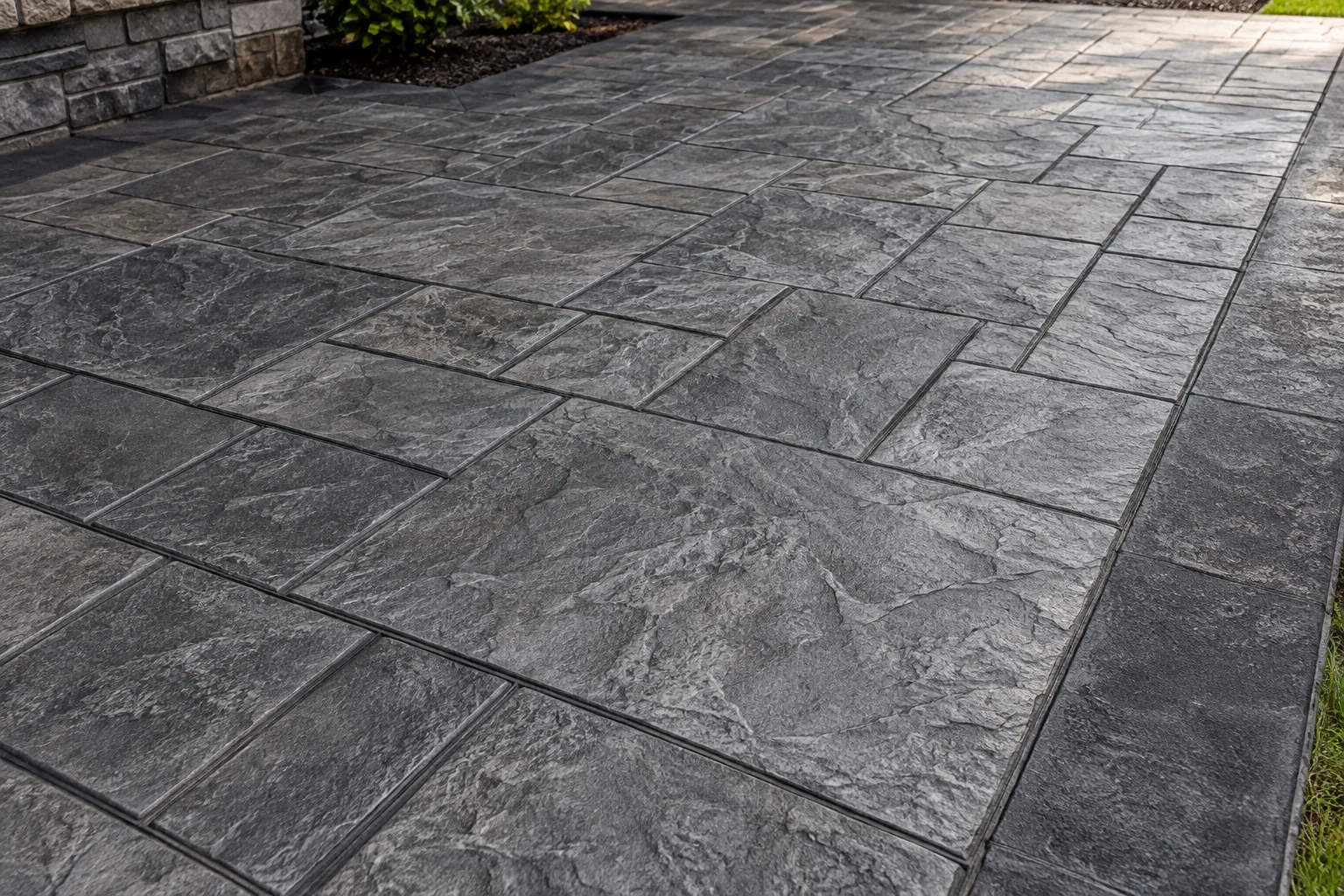 Close-up concept of charcoal slate-pattern stamped concrete